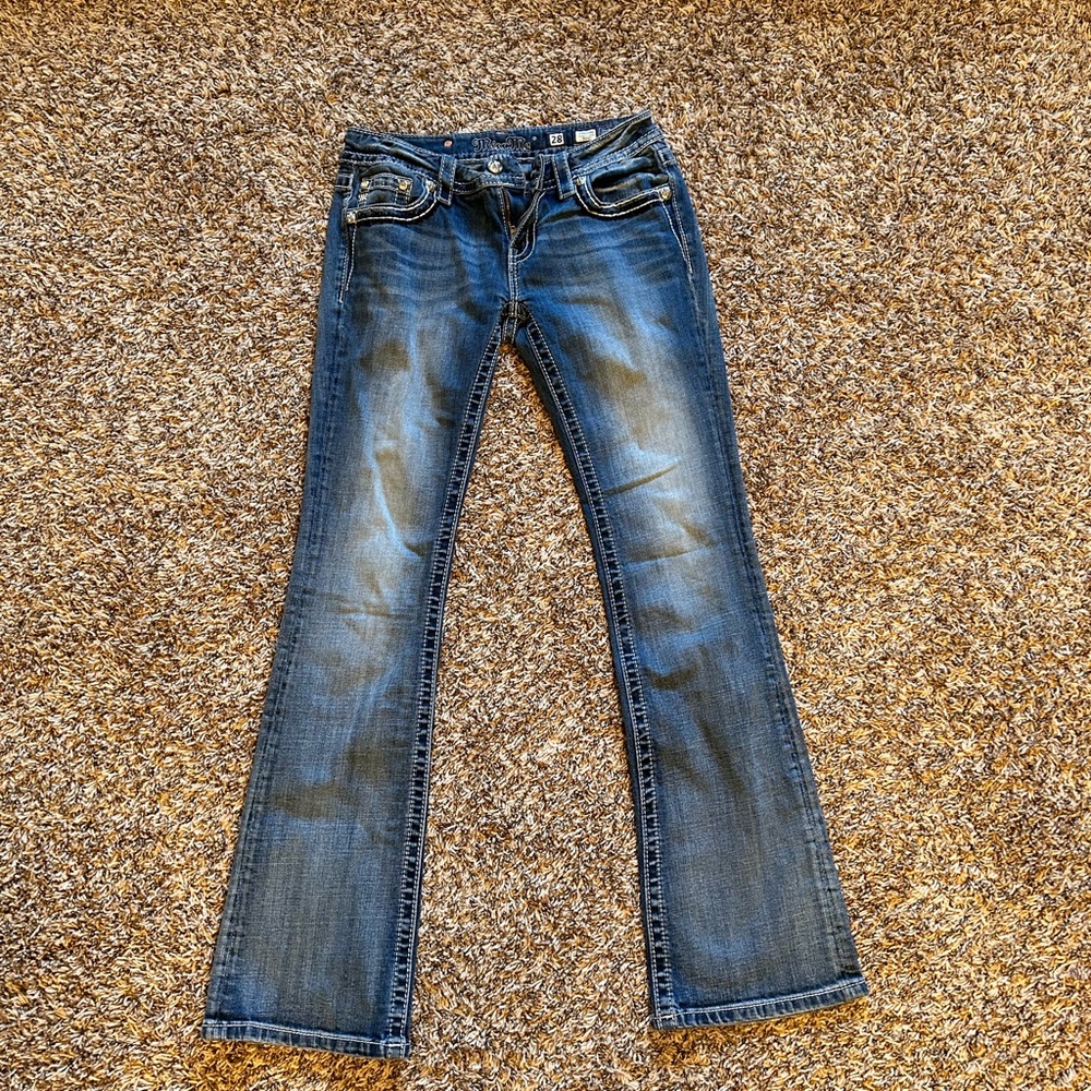 Miss Me Mid Rise Signature Boot Jean